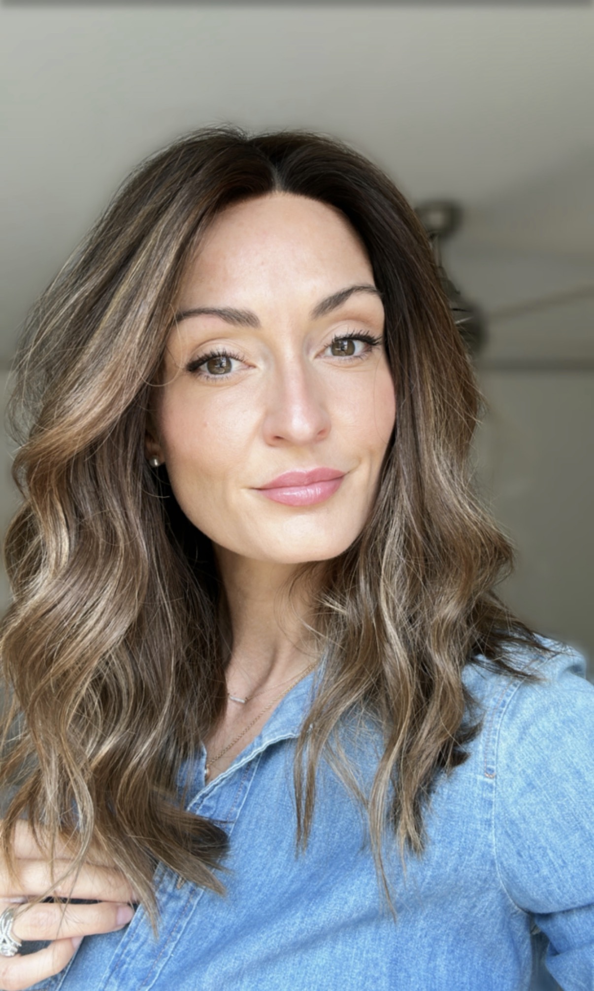 woman wearing a wig thinking